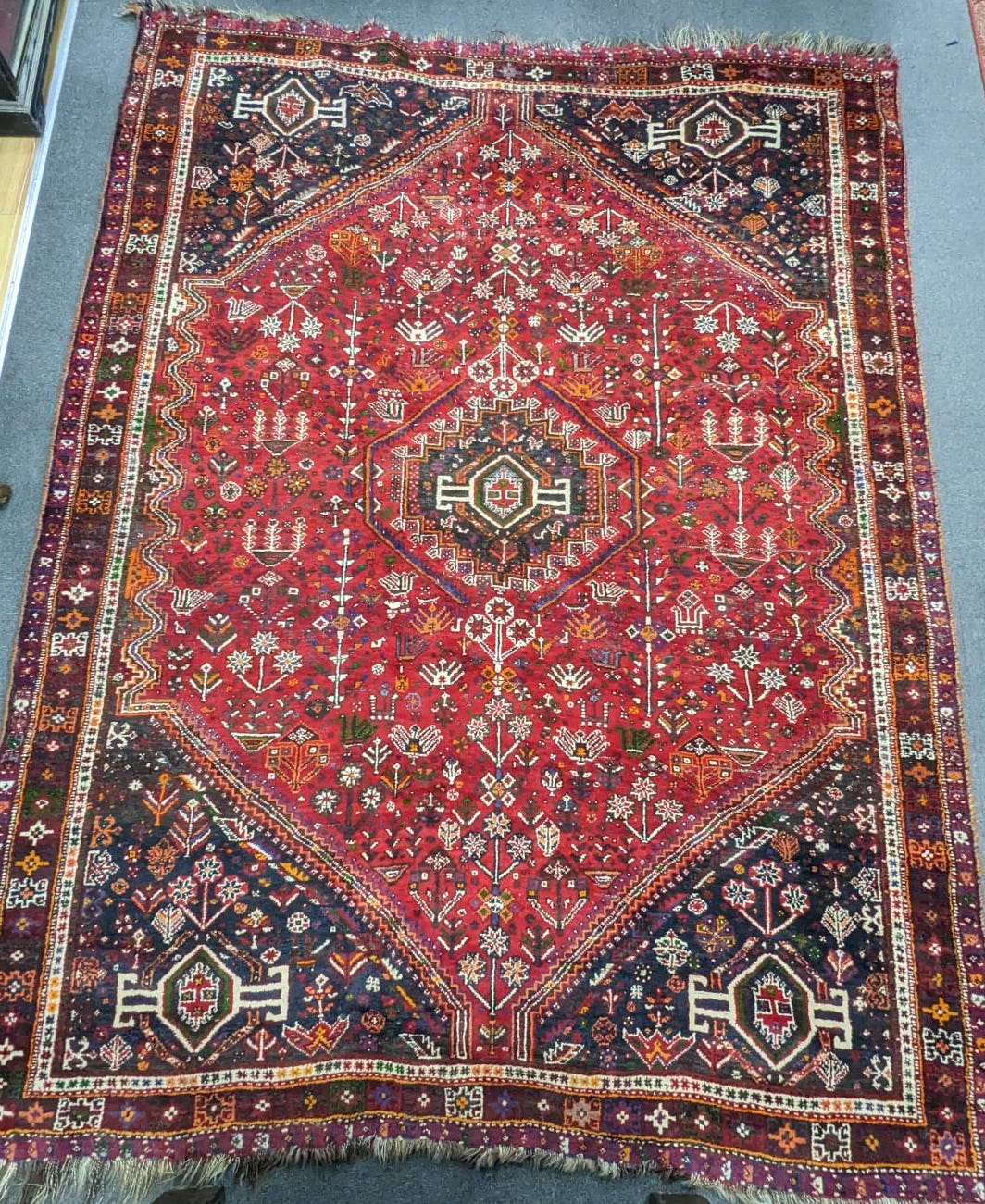 A Hamadan red ground carpet, 294 x 216cm